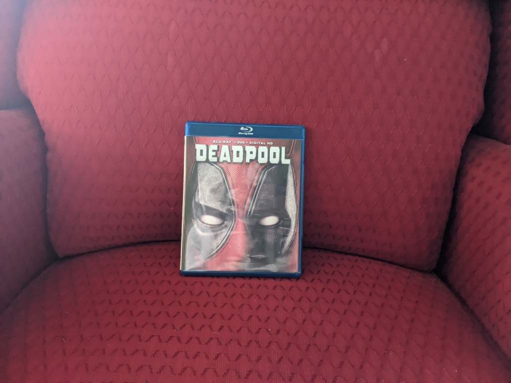 Deadpool Blu-Ray cover sitting in a red arm chair
